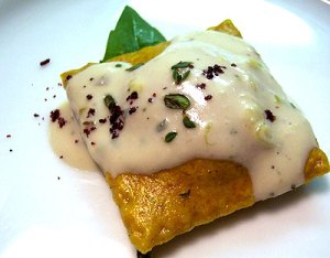 Roasted Pumpkin Ravioli with Thyme and Riesling Cream courtesy of 4 Course Vegan